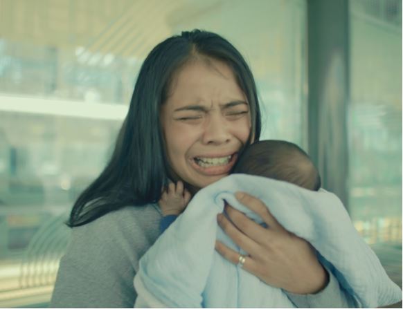 A person holding a babyDescription automatically generated with medium confidence A person holding a babyDescription automatically generated with medium confidence